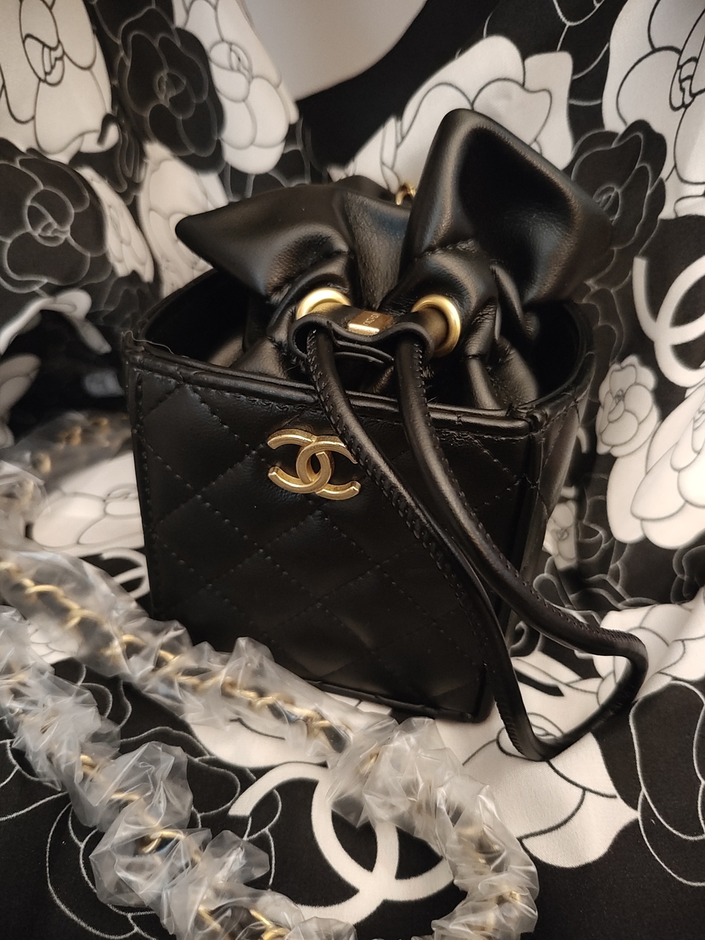 Black Diamond Quilted Mini Drawstring Bucket Bag with Gold Hardware
